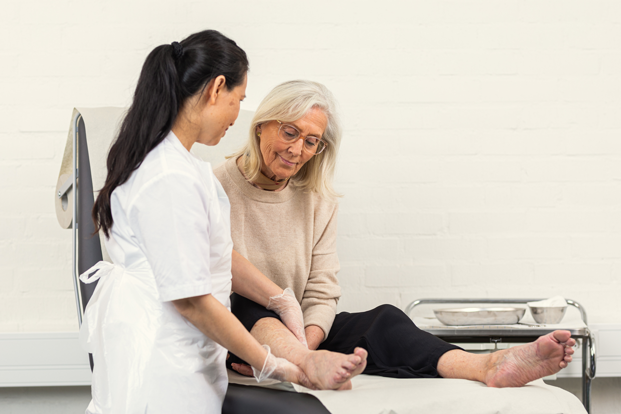 Patient in bed and nurse standing